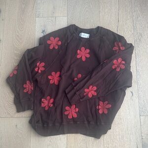 THE GREAT. Chocolate Brown Sweater with Red Floral Accents